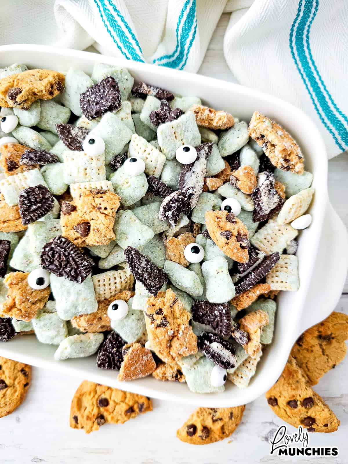 A sweet and crunchy Cookie Monster Puppy Chow recipe with chocolate, peanut butter, and crushed cookies.